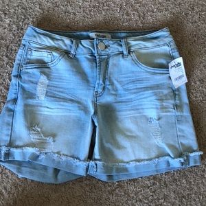 Blue shorts with small rips